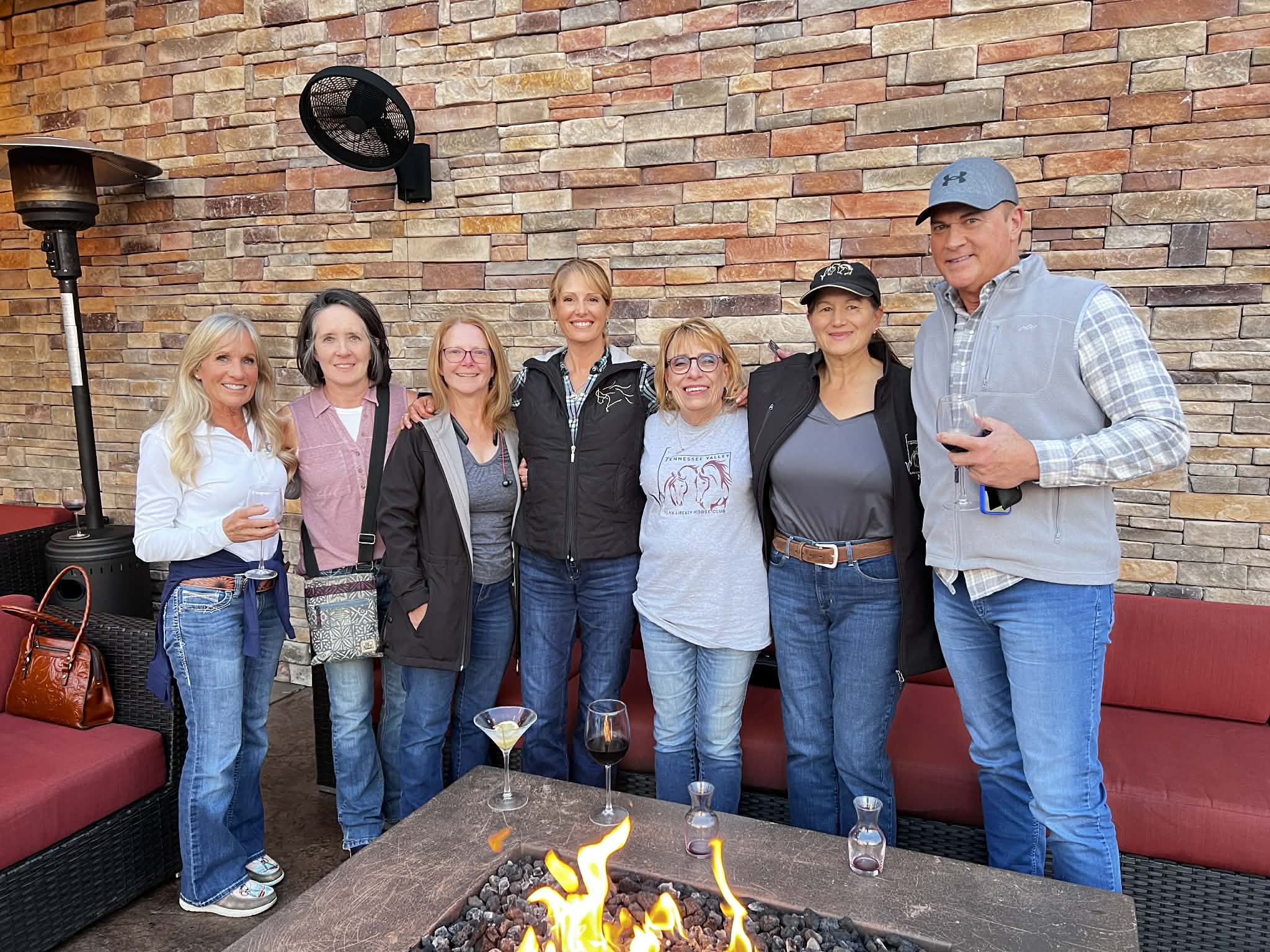 Club members gathered around a fire pit