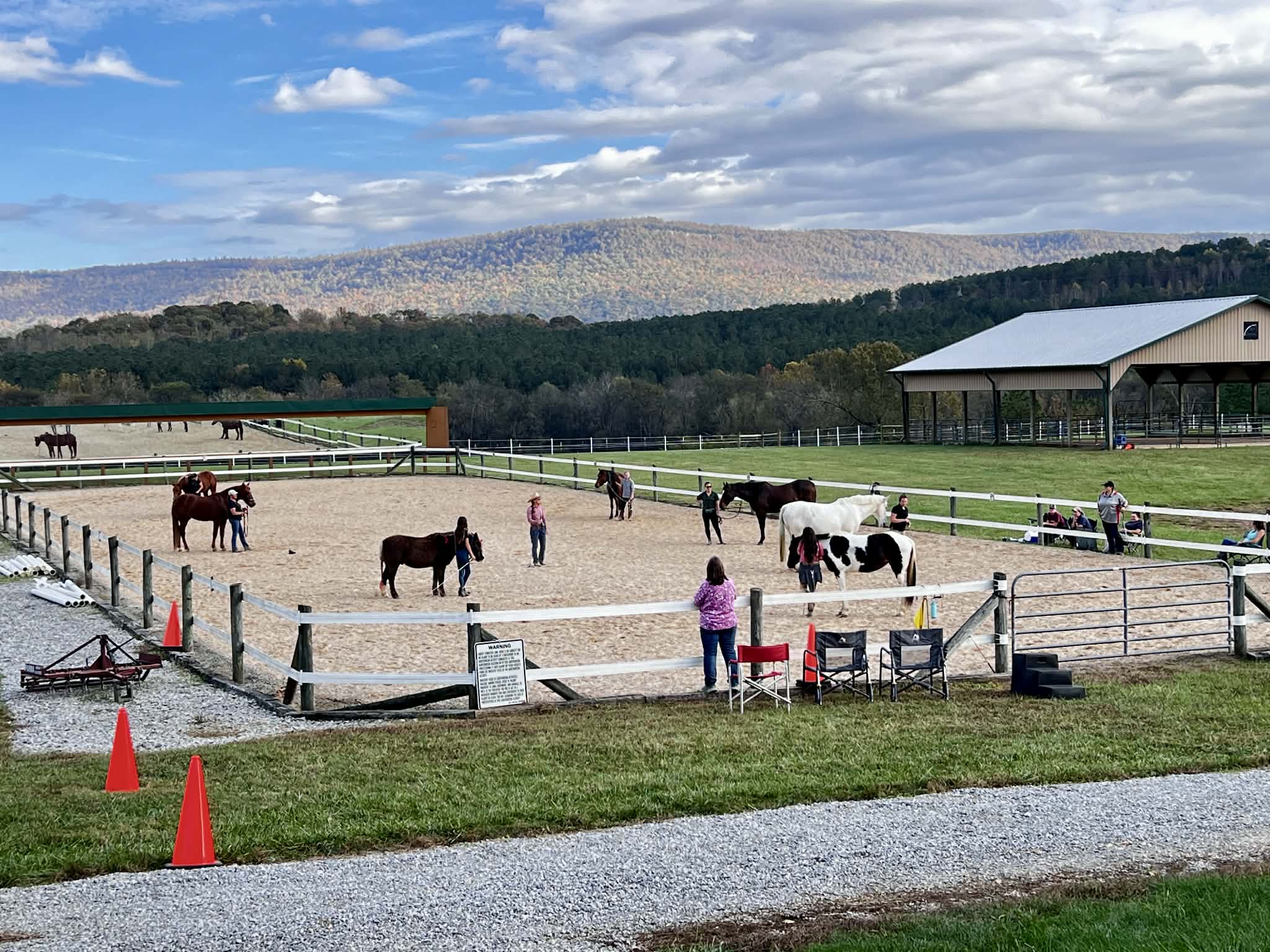 Members gathered outside a barn at a club event