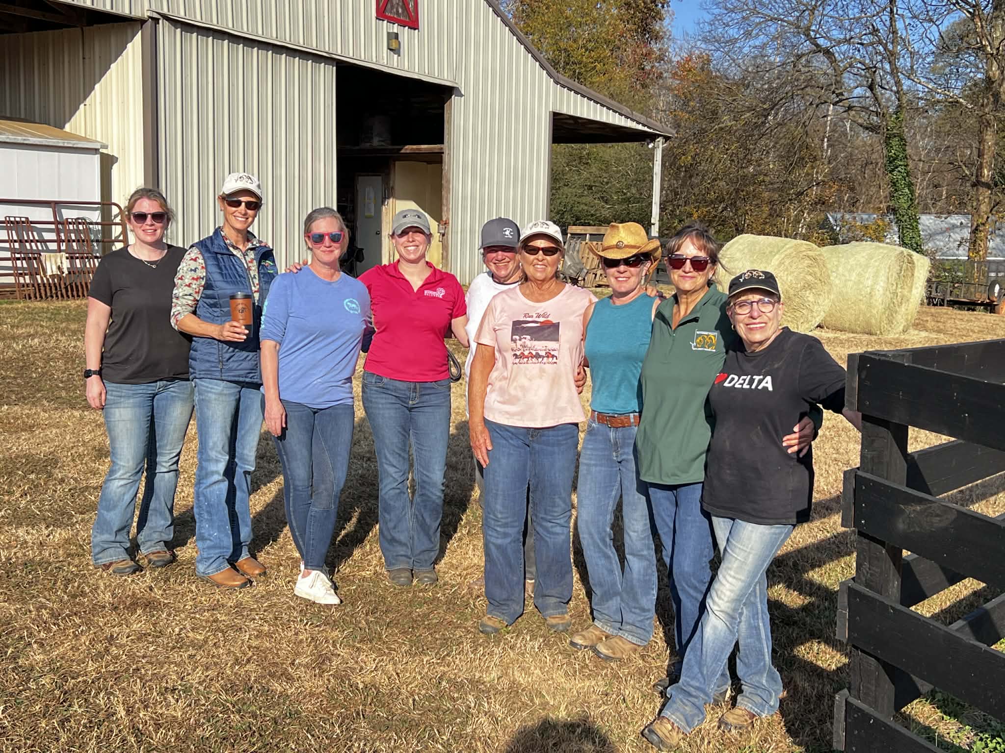 Club members with dogs at the barn after a clinic